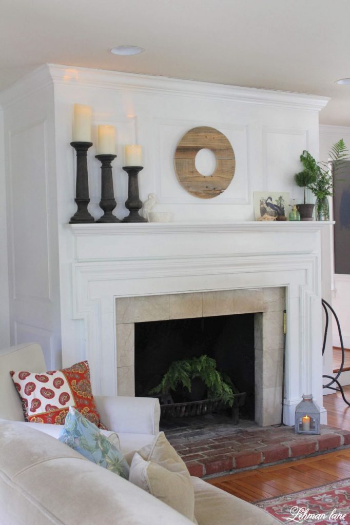 Summer Mantel with Greenery - Summer is the time of year my plants go on holiday to our backyard. However, I always bring a few in to add color to my fireplace mantel. I want my summer mantel to be as colorful & green as the yard outside my window. Decorating with greenery can be easy as pie & totally free when it's found in your home garden. Check out my summer mantel below along with even more summertime mantel decorating ideas from my blogging friends! #summermantel http://lehmanlane.net