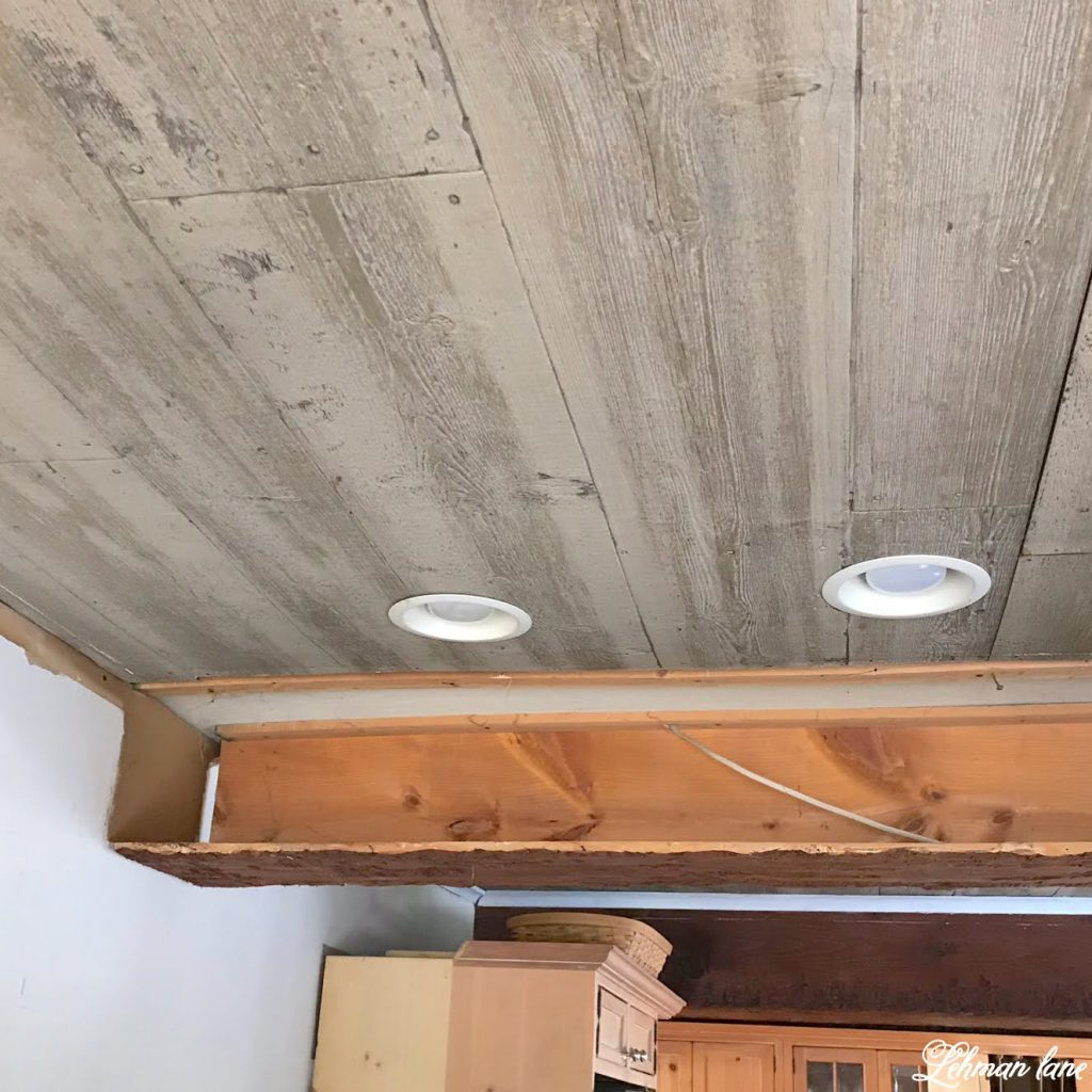 Taking Down the Faux Beam & Faux Wood Ceiling - These days people are adding faux beams to their ceilings but today I am sharing why we decided to take down the faux beam and faux wood ceiling in our farmhouse kitchen. #fauxbeam #beadboard http://lehmanlane.net