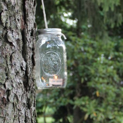 Learn how to make a Mason Jar Lantern in under a minute with simple supplies you have at home perfect for a nighttime summer garden party.