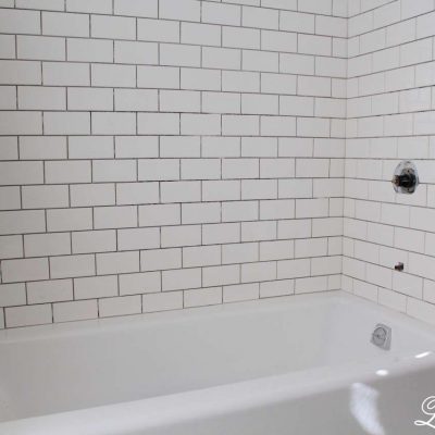 How to Move a Cast Iron Bathtub - Tub with White Subway Tile Renovation