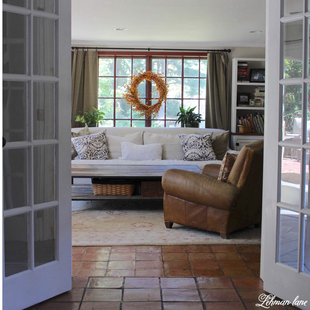 I have long wanted to paint the doors in our family room white. Painting the doors and trim white allowed for more neutral decorating, a more cohesive feel from room to room and makes our family room feel brighter and bigger.  Stop by to check it out #familyroom #whitepaint http://lehmanlane.net
