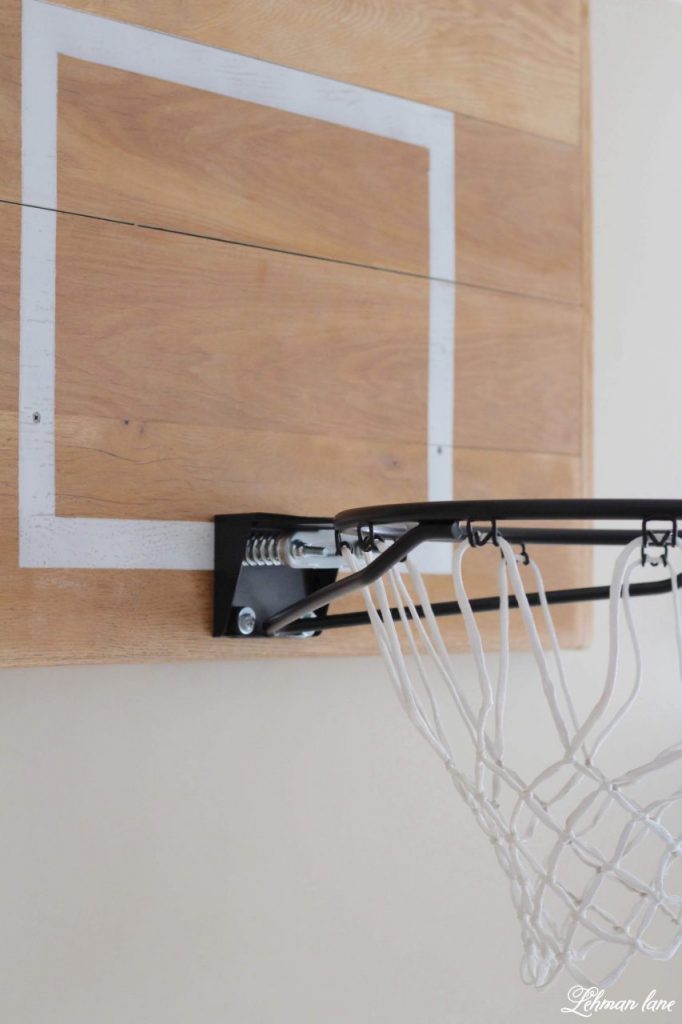 Our DIY Wood basketball hoop was incredibly easy to make & only took a few hours build for just the cost of a basketball rim.  And it's a hit for those home bound rainy days!!! #basketball #diy #basketballhoop https://lehmanlane.net