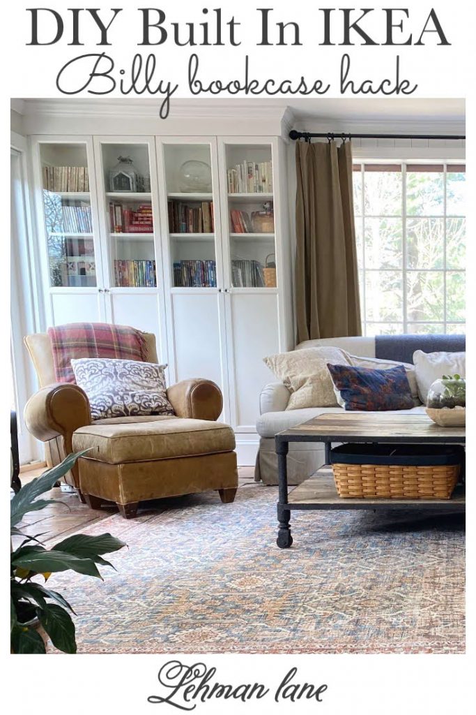Sharing all our tips & tricks for an awesome DIY Ikea Billy bookcase hack built in with Oxberg Glass Doors flanking a large garden window to create a small home library wall unit & add storage to our family room with a step by step tutorial & pictures. #ikeabillybookcasehack #builtins #diyprojects https://lehmanlane.net