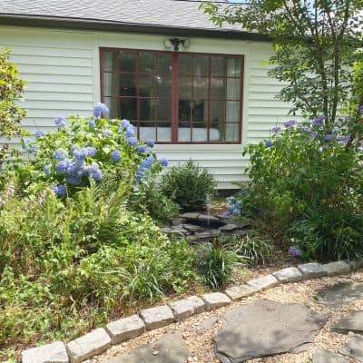 Sharing my 3 easy & beautiful tips & gardening ideas for landscaping under a front window or a picture window that are low maintenance. With easy to plant shrubs that look fabulous with step by step instructions and pictures on a budget! #gardeningunderawindow #gardeningforbeginners https://lehmanlane.net