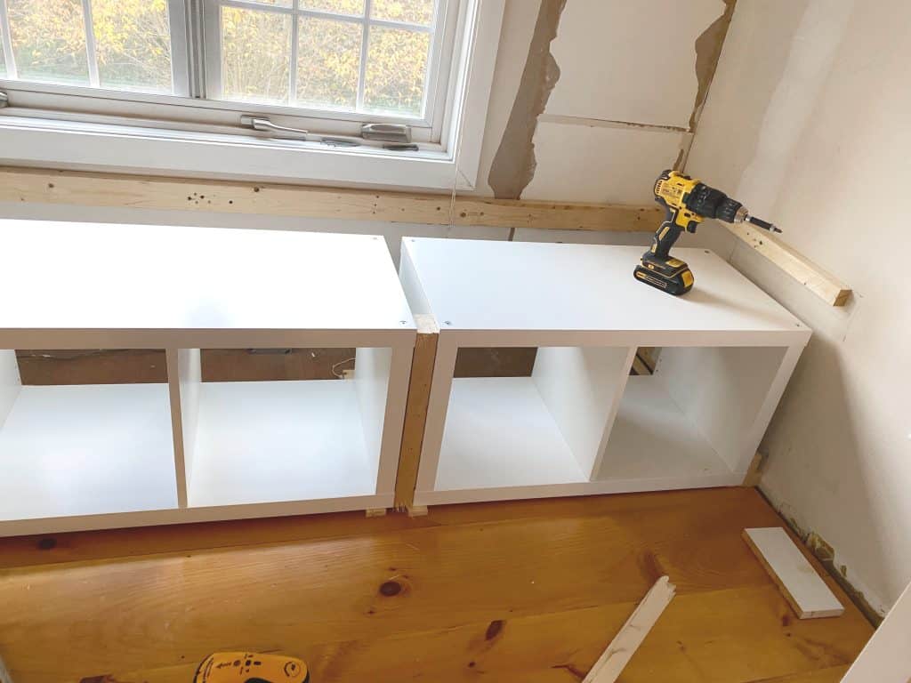 Sharing all our tips and tricks of how we made this easy and awesome DIY Window Seat using a Ikea Kallax Hack Bookshelf as a Bench with step by step pictures. We made the Kallax window seat large enough so it could double as a bed for overnight guests with bookcases underneath to provide extra storage.