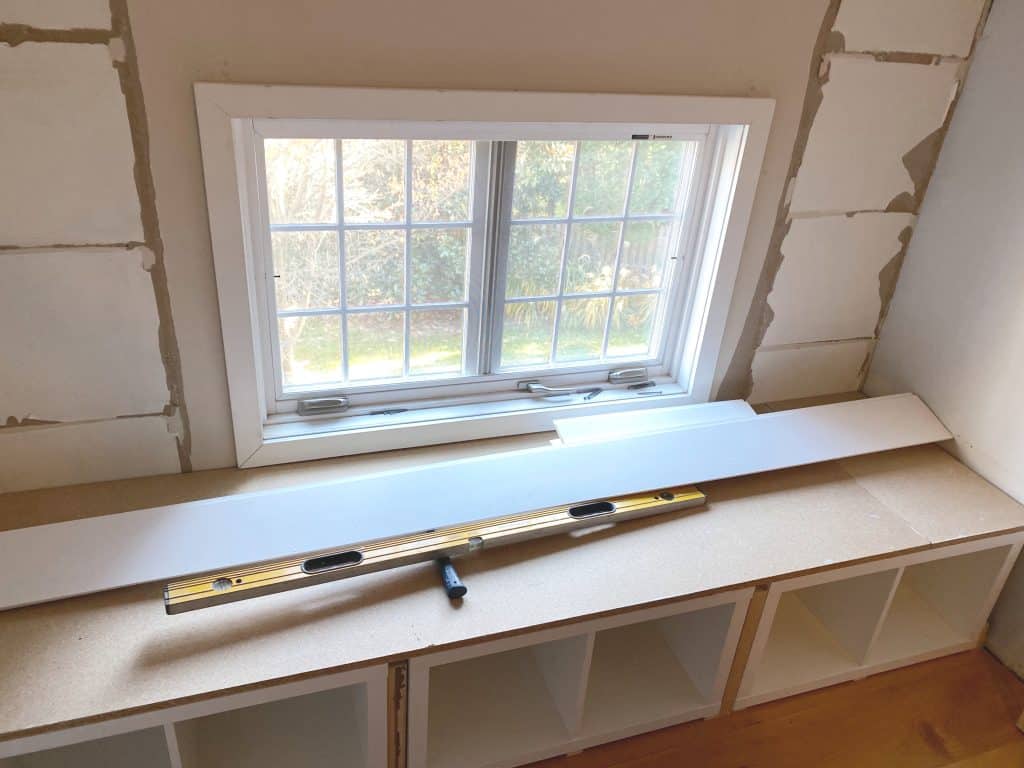 Sharing all our tips and tricks of how we made this easy and awesome DIY Window Seat using a Ikea Kallax Hack Bookshelf as a Bench with step by step pictures. We made the Kallax window seat large enough so it could double as a bed for overnight guests with bookcases underneath to provide extra storage.